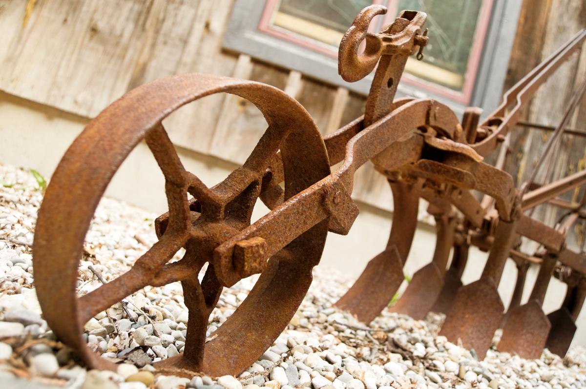 Old rusty equipment displayed outdoors like a museum piece instead of being sold while it still has value
