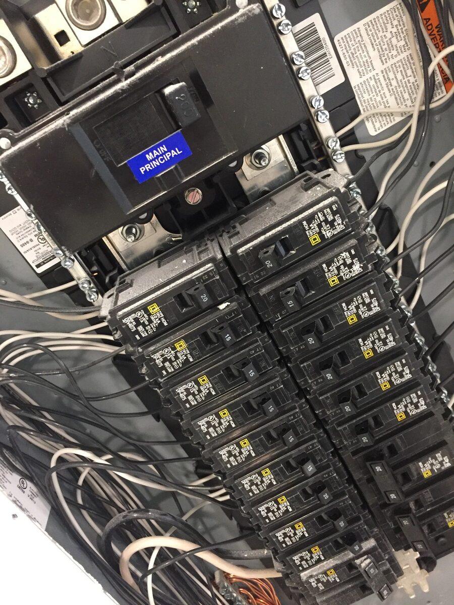 Electrical panel interior with wiring and circuit breakers that may be sold as surplus or take-out stock