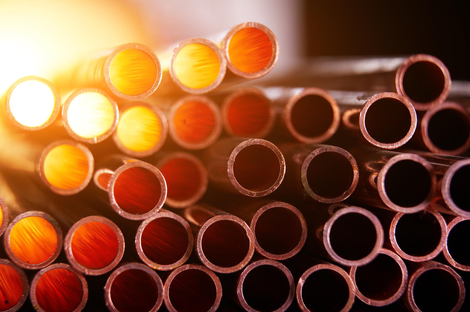 Copper pipe inventory and copper plates stored in a warehouse ready for liquidation or resale