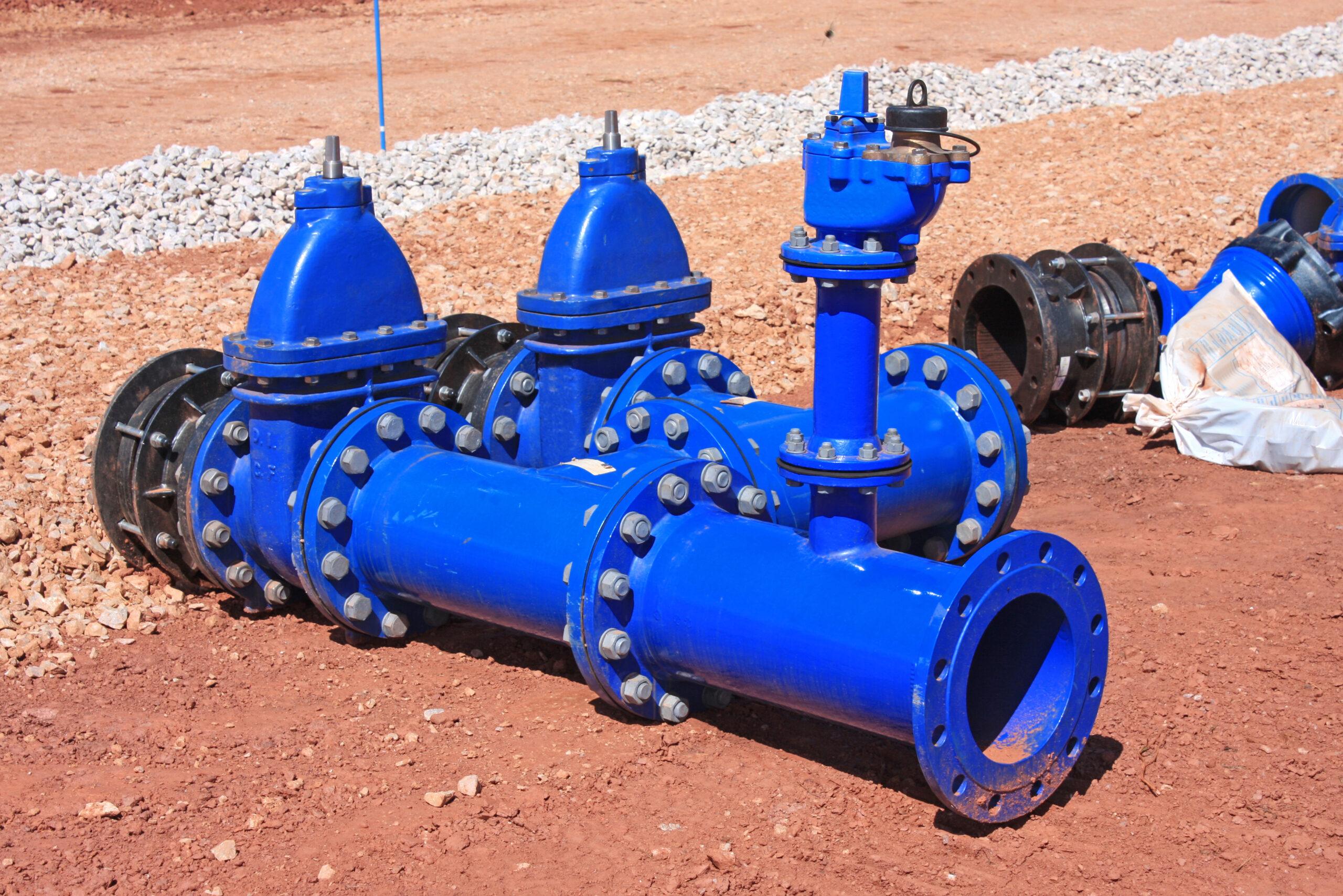 Blue industrial piping equipment ready for installation representing clean warehouse surplus water valves and flow-control stock