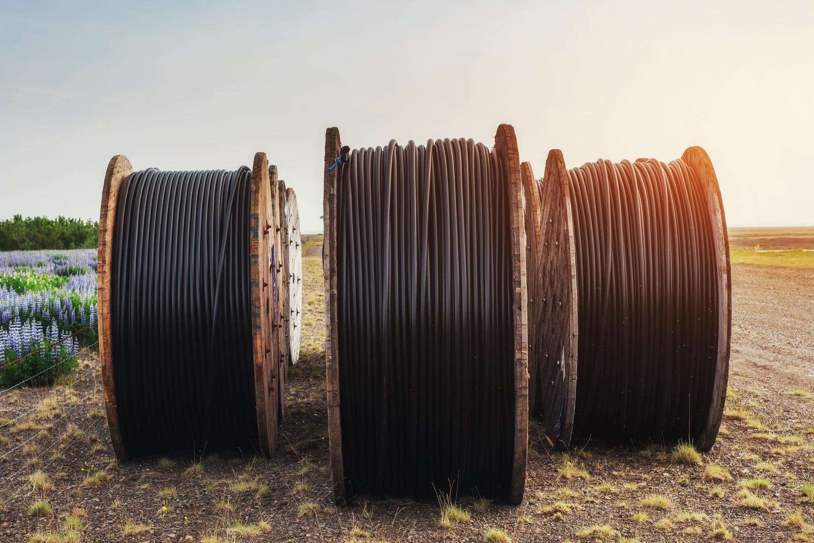 Spools of cable stored outdoors after utility or infrastructure work and ready for resale